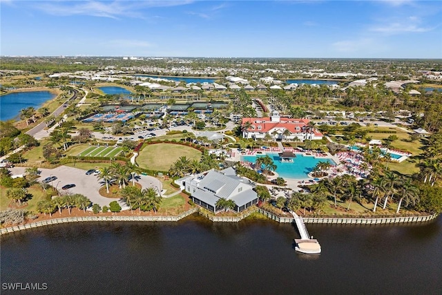 birds eye view of property with a water view