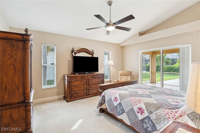 carpeted bedroom featuring ceiling fan, access to exterior, vaulted ceiling, and multiple windows