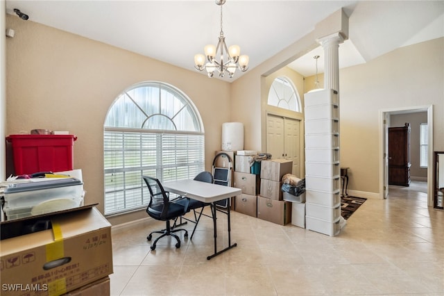 office with light tile patterned flooring, an inviting chandelier, and ornate columns