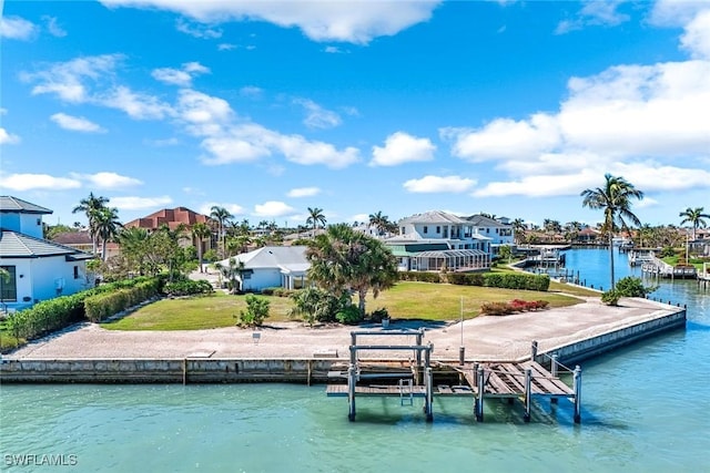 980 Iris Ct, Marco Island, FL 34145 - dock area featuring a water view, a yard, boat lift, and a residential view
