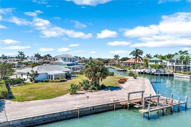 980 Iris Ct, Marco Island, FL 34145 - view of dock with a lawn, a water view, and a residential view