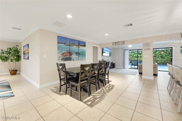 tiled dining space with ornamental molding