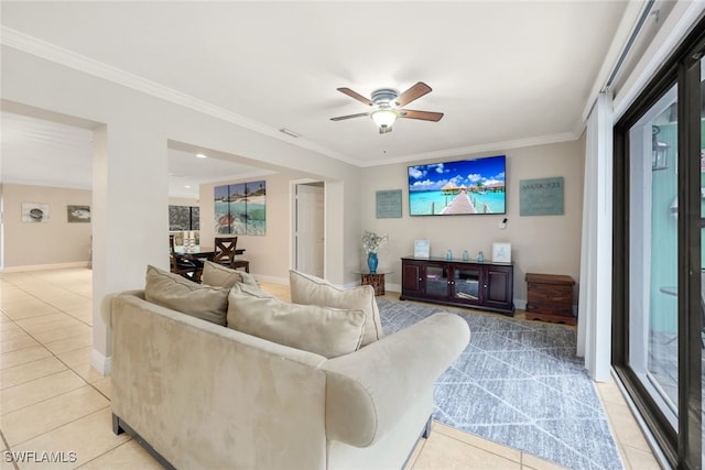 living room featuring ornamental molding, light tile patterned floors, and ceiling fan