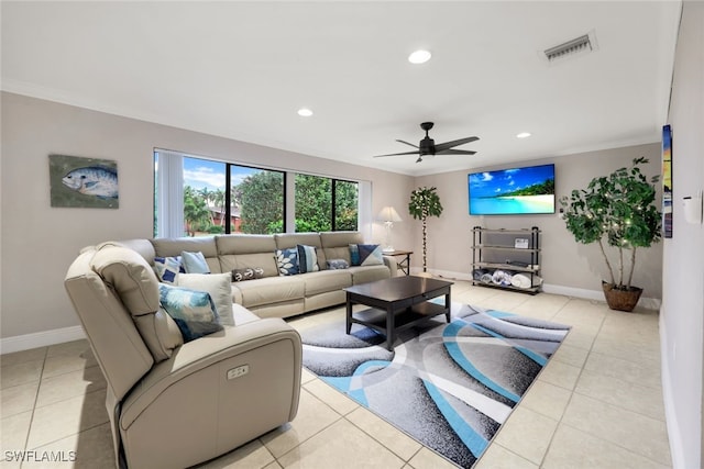 living room with light tile patterned floors, crown molding, and ceiling fan