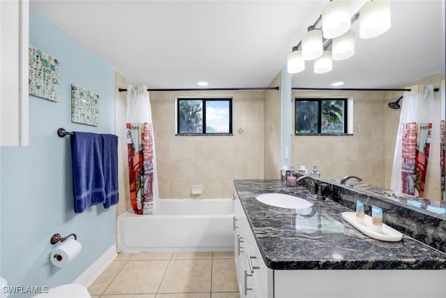 bathroom with tile patterned flooring, vanity, and shower / bath combo with shower curtain