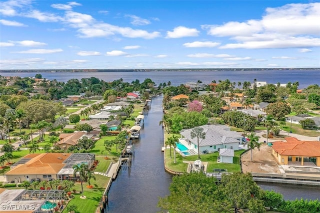 birds eye view of property with a water view