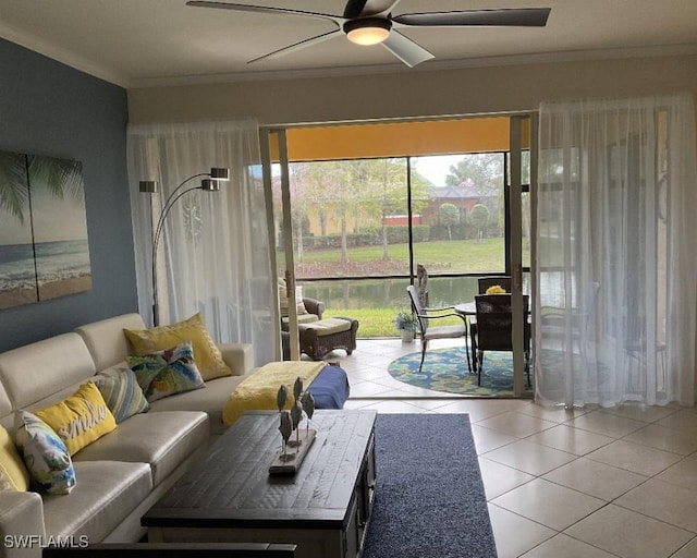 tiled living room with crown molding, a wealth of natural light, and ceiling fan