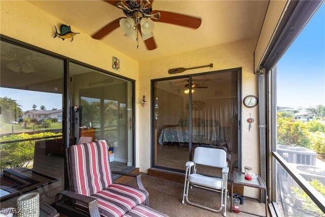 sunroom / solarium with ceiling fan