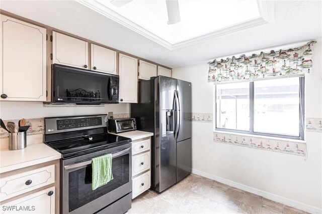 kitchen with crown molding, ceiling fan, appliances with stainless steel finishes, and a raised ceiling