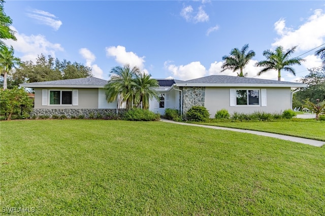 ranch-style home with a front yard