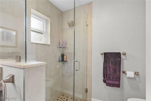 bathroom with toilet and walk in shower