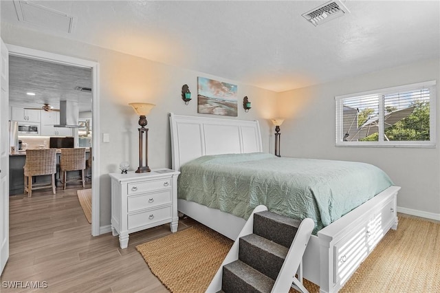 bedroom with light hardwood / wood-style flooring