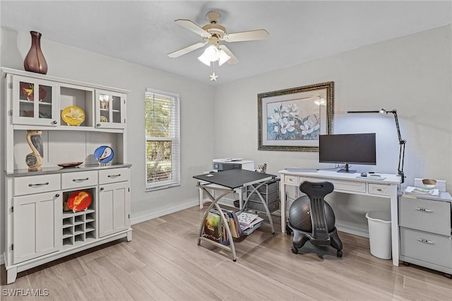 office space featuring ceiling fan and light hardwood / wood-style floors