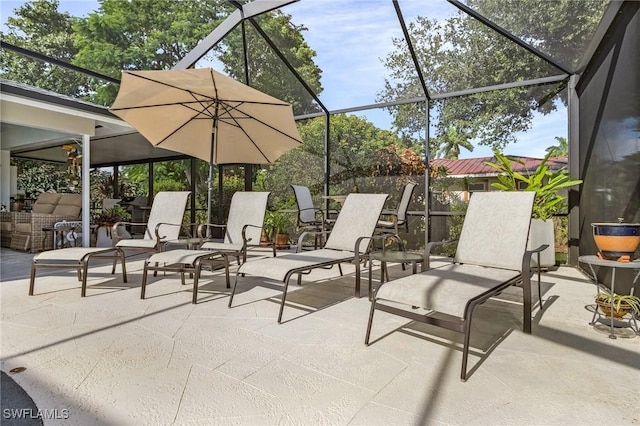 view of patio with a lanai