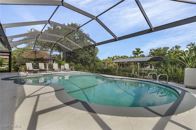 view of pool featuring a patio area and glass enclosure