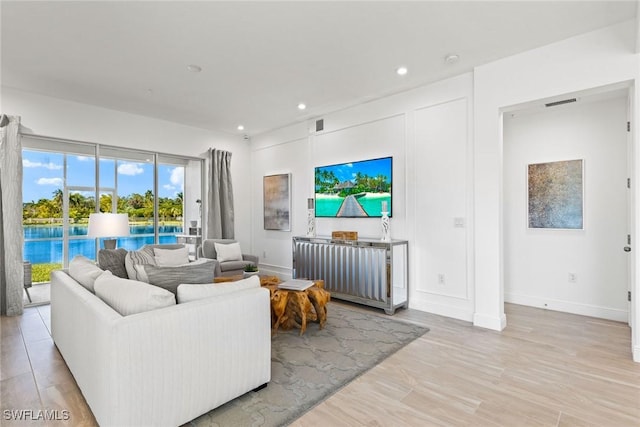 living room with light hardwood / wood-style flooring