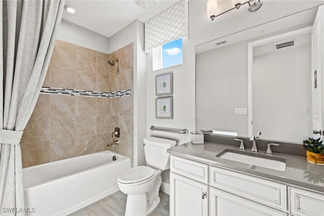 full bathroom with toilet, vanity, and shower / bath combo with shower curtain