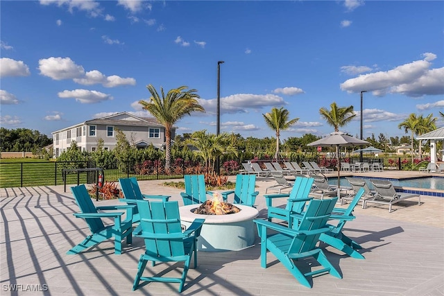 view of patio with a fire pit