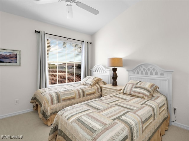 bedroom featuring vaulted ceiling, carpet flooring, and ceiling fan