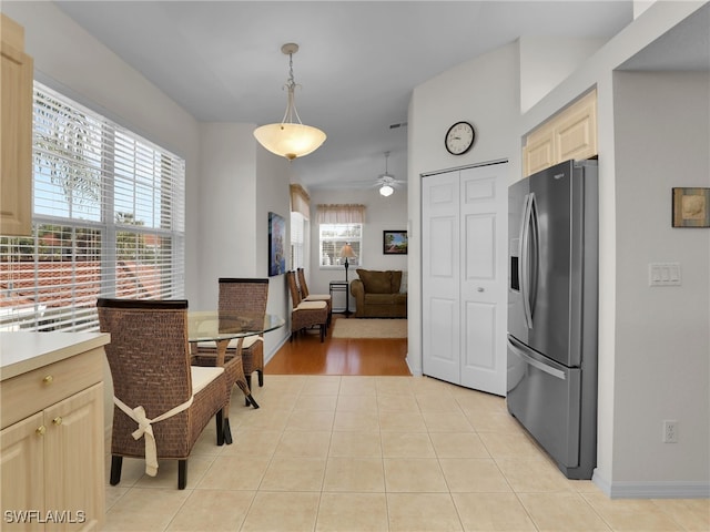 tiled dining room with ceiling fan