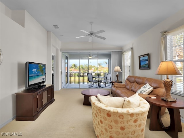 carpeted living room with lofted ceiling, a healthy amount of sunlight, and ceiling fan