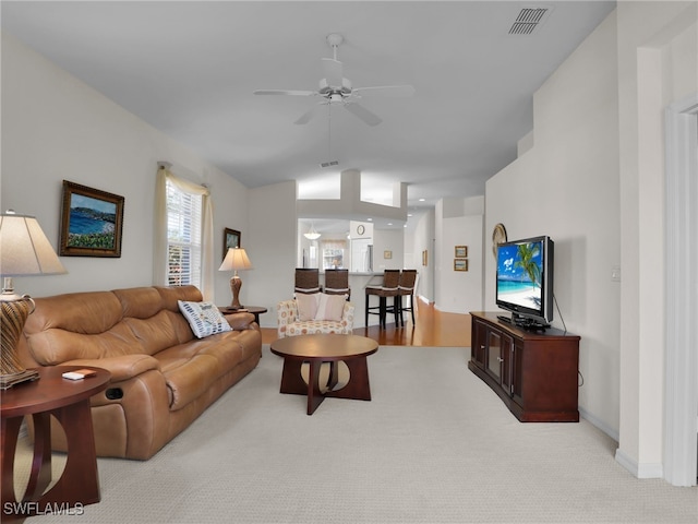 living room featuring ceiling fan