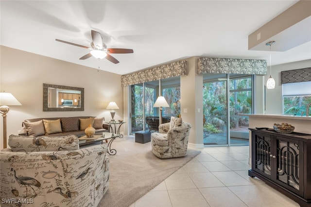 carpeted living room featuring ceiling fan