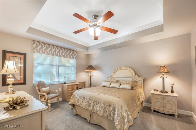 bedroom with light carpet, crown molding, ceiling fan, and a raised ceiling