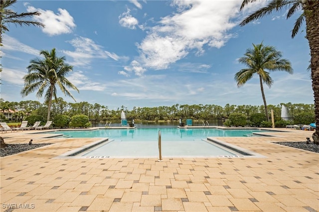 view of swimming pool featuring a patio area