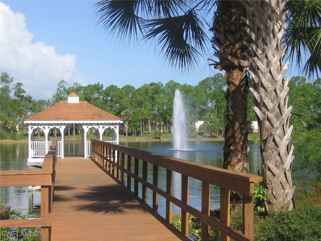 view of dock featuring a water view and a gazebo