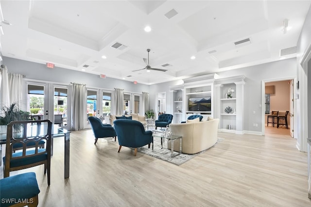 living room featuring coffered ceiling, light hardwood / wood-style floors, beam ceiling, and french doors