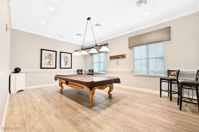 recreation room with a wealth of natural light, pool table, ornamental molding, and light wood-type flooring