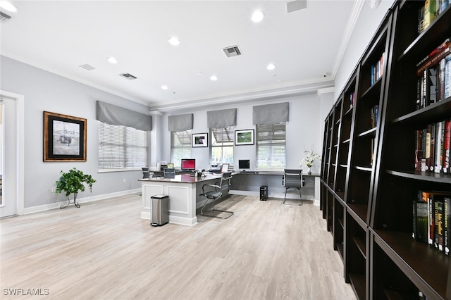 office space with light hardwood / wood-style floors and ornamental molding