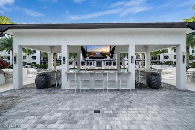 view of patio featuring an outdoor bar