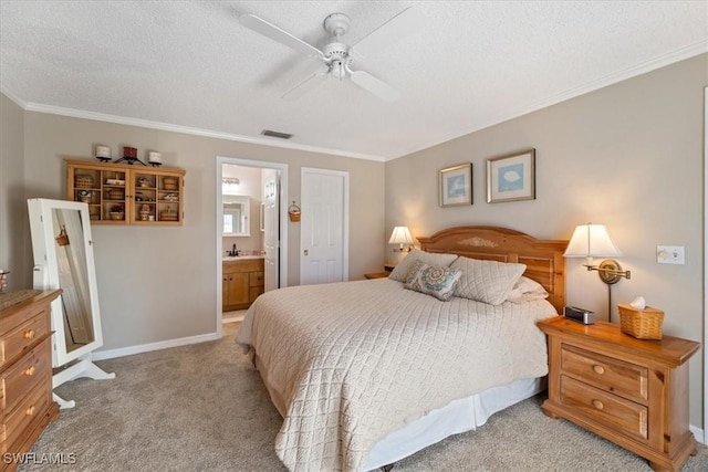 bedroom with ensuite bath, ceiling fan, ornamental molding, a textured ceiling, and light carpet