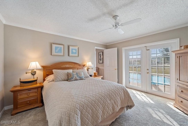 carpeted bedroom featuring ceiling fan, access to exterior, ornamental molding, a textured ceiling, and french doors