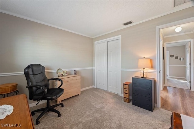 office area featuring crown molding and carpet flooring