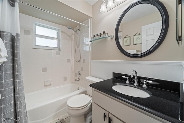 full bathroom with vanity, toilet, and shower / tub combo