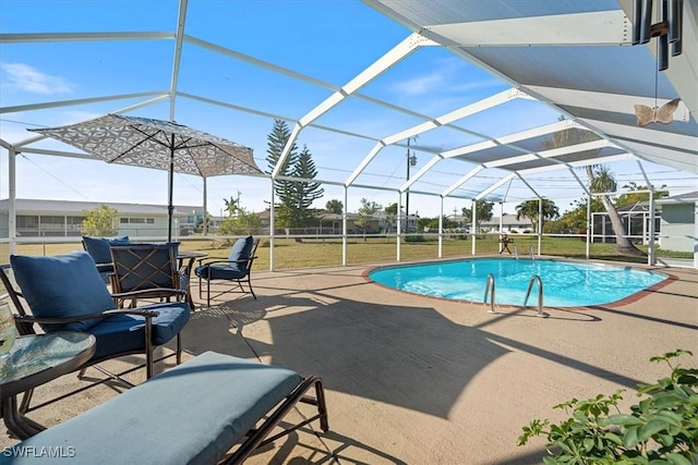 view of swimming pool with a yard, a lanai, and a patio