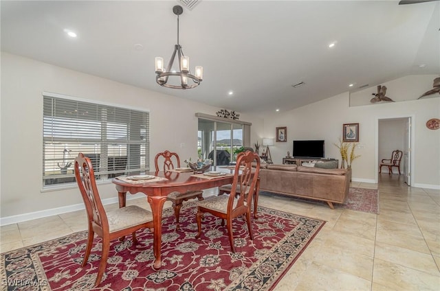 dining area with an inviting chandelier, light tile patterned floors, and lofted ceiling