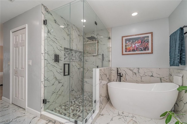 bathroom featuring plus walk in shower and tile walls