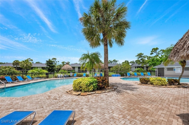 view of swimming pool with a patio