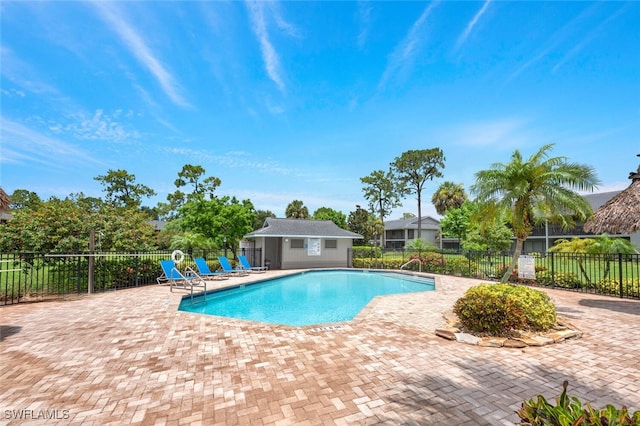 1207 Commonwealth Cir Unit B201, Naples, FL 34116 - community pool with a patio and an outdoor structure