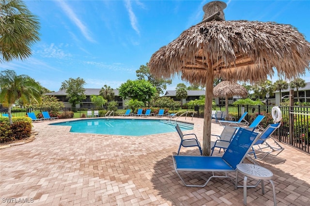 view of swimming pool featuring a gazebo and a patio