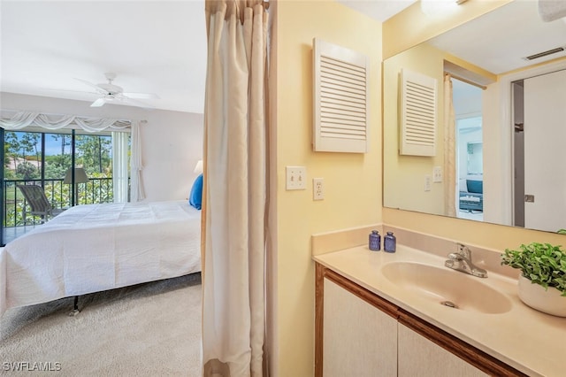 bathroom with ceiling fan and vanity