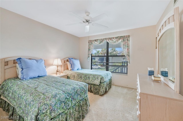 bedroom with ceiling fan and carpet floors