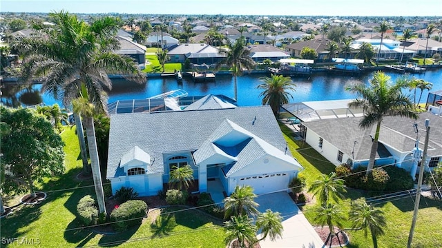 birds eye view of property featuring a water view