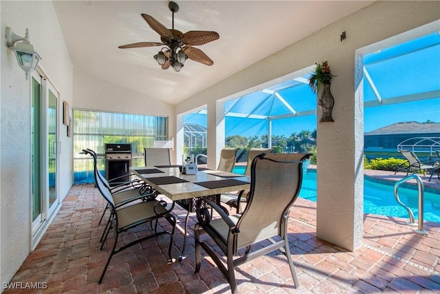 view of patio / terrace with a grill, a lanai, and ceiling fan