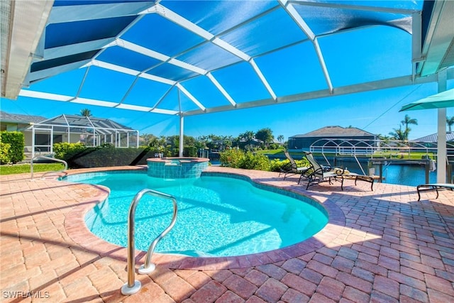 view of pool featuring a patio area, an in ground hot tub, glass enclosure, and a water view