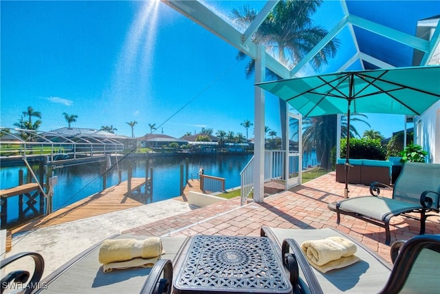 view of patio featuring an outdoor hangout area, a dock, and a water view